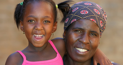 Mother and daughter smiling together